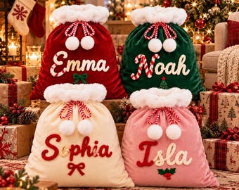 May include: Four plush velvet Christmas gift sacks in red, green, cream, and pink. Each sack features a white faux fur trim, drawstring closure with pom-poms, and personalized names: Emma, Noah, Sophia, and Isla, embroidered in festive fonts.