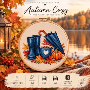 May include: A cross stitch pattern titled Autumn Cozy featuring a design of blue rain boots, a blue umbrella, a blue mug with a white heart, and an orange pumpkin surrounded by autumn leaves. The pattern includes 160 by 134 stitches and 23 DMC colors.