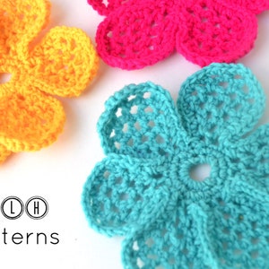 May include: Three crocheted flowers in yellow, pink, and turquoise. The flowers are made with a simple stitch pattern and have a delicate, feminine look.