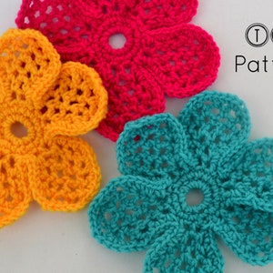 May include: Three crocheted flowers in yellow, pink, and teal. The flowers are all the same design, but in different colors. The flowers are on a white background. TLH Patterns is written in black text on the right side of the image.