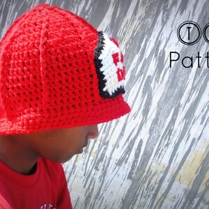 May include: A red crocheted firefighter hat with a black and white "Fire Dept" patch. The hat has a wide brim and is being worn by a child.