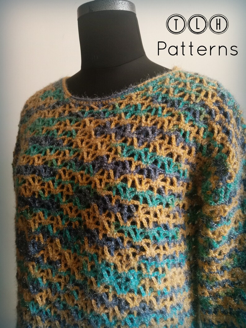 May include: A crocheted sweater with a geometric pattern in shades of teal, brown, and gray. The sweater is displayed on a mannequin. The text "TLH Patterns" is visible in the upper right corner of the image.