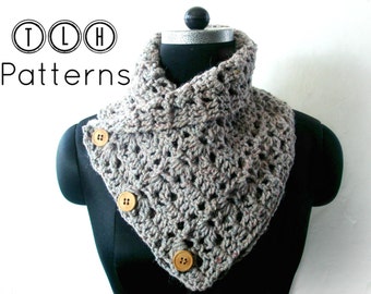 May include: A gray crocheted cowl with a button closure. The cowl is on a black mannequin. The text "TLH Patterns" is in the top left corner of the image.