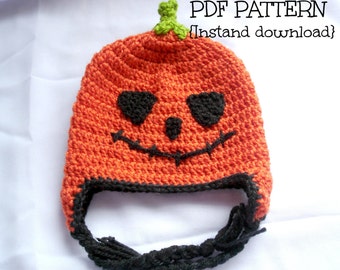 May include: Crochet pattern for a pumpkin hat with a black face and green stem. The pattern is available for instant download as a PDF.