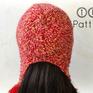 May include: Red and yellow crocheted hat with a long tail. The hat is made with a textured stitch and has a slouchy fit.