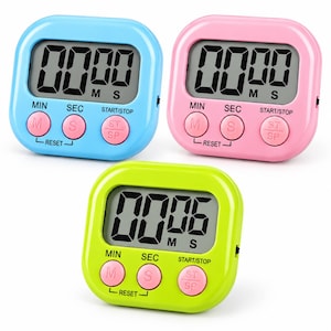 May include: Three digital kitchen timers in light blue, pink, and lime green. Each square device features a large LCD screen displaying numbers, with three round pink buttons labelled MIN, SEC, and START/STOP. The text RESET is printed below.