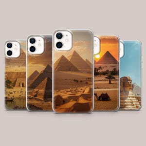 May include: Five clear smartphone cases arranged in a row, each featuring a different high-resolution print of Egyptian pyramids, desert landscapes, a camel, and the Great Sphinx under various lighting conditions from golden hour to bright daylight.