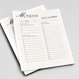Op de afbeelding: Een dagplanner-vel gedrukt op off-white papier met zwarte tekst. De koptekst bevat Monday en Daily Planner. Secties omvatten Today's Date, Daily Big 3, een schema met uurslots van 6 tot 20 uur en een takenlijst met selectievakjes.