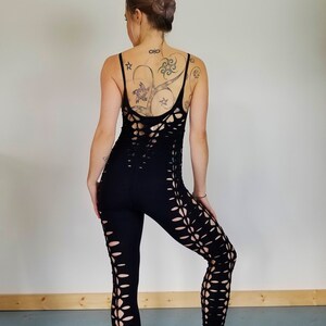May include: Black leggings with cutouts in a floral pattern. The leggings are made of a stretchy, comfortable fabric.