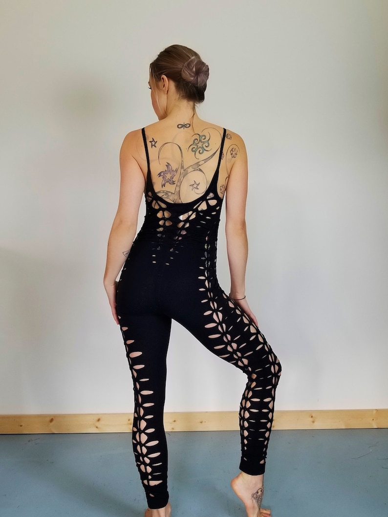 May include: Black leggings with cutouts in a floral pattern. The leggings are made of a stretchy, comfortable fabric.