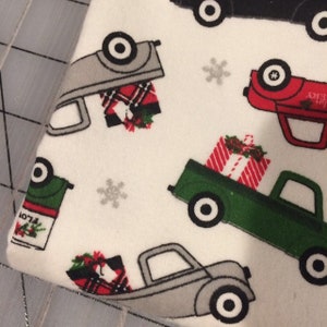 Christmas Delivery in Cream on FLANNEL- Continuous Yardage Sold in Half Yard Increments