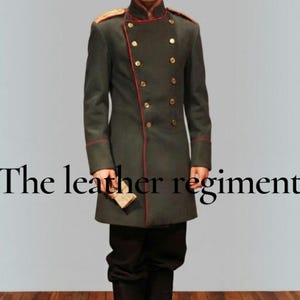 May include: A dark olive green military-style coat featuring a high collar, double-breasted gold buttons, and thin red piping along the front closure and shoulders. The text "The leather regiment" is overlaid across the center of the coat.