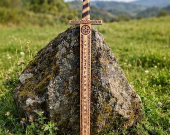 May include: A wooden sword featuring a light brown finish with dark brown accents. The blade is engraved with runic symbols and a circular knotwork design. The hilt has a wrapped handle and a circular pommel with a triangular symbol engraved on it.