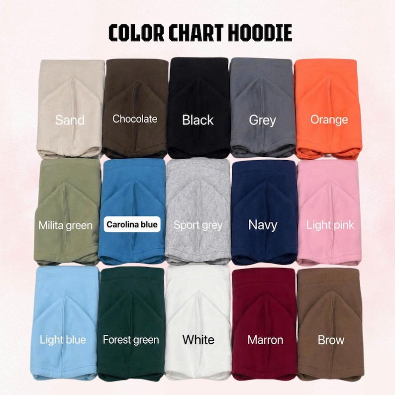 May include: A color chart for hoodies featuring fifteen folded fabric samples in various shades including sand, chocolate, black, grey, orange, military green, Carolina blue, sport grey, navy, light pink, light blue, forest green, white, maroon, and brown.