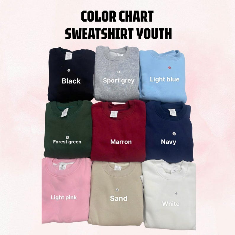 May include: A color chart for youth sweatshirts featuring nine crewneck pullovers in black, sport grey, light blue, forest green, maroon, navy, light pink, sand, and white. The text reads COLOR CHART SWEATSHIRT YOUTH with labels for each color.