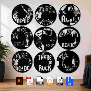 May include: A collection of nine circular black and white wall art pieces featuring AC/DC band imagery, band members, and text including Highway to Hell and Let There Be Rock. Each circular design displays distinct graphic illustrations of the rock band.