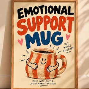 May include: A framed poster featuring a speckled mug with orange stripes and a smiling face hugging itself. The text reads EMOTIONAL SUPPORT MUG, HOT WONKY NECESSARY, and MADE WITH CLAY & QUESTIONABLE DECISIONS, accented by two small pink hearts.