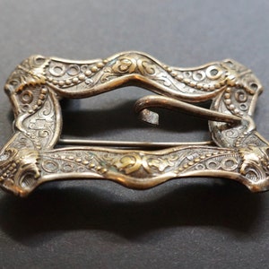 1890s Ornate, Buckle-shaped Sash Pin in silver tone metal. Victorian