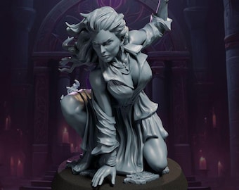 May include: A gray resin miniature figure of a character in a dynamic crouching pose with one arm raised. The figure wears a flowing garment with long sleeves and a necklace, featuring detailed hair and facial features, mounted on a circular base.