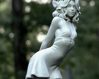May include: A light gray resin figurine of a figure with wavy hair and curled horns, wearing a short dress with a lace-up bodice detail. The sculpture features a smooth matte finish and is depicted in a standing pose with a slight forward lean.