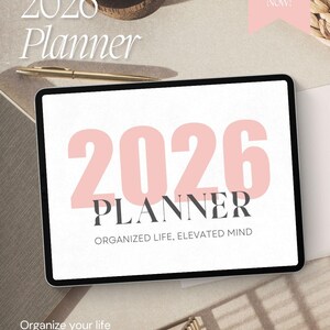May include: A digital tablet displaying a 2026 planner with large pink numbers and dark gray text that reads 2026 PLANNER and ORGANIZED LIFE, ELEVATED MIND. The screen also features the text Organize your life effortlessly and Get Yours Now.