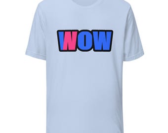 May include: A light blue short-sleeve t-shirt featuring the word WOW printed in the center. The letters are outlined in black, with the W on the left colored in pink, and the O and W colored in blue, creating a bold graphic design.