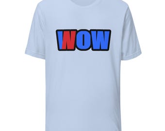 May include: A light blue short-sleeve t-shirt featuring the word WOW printed in a bold, block-style font across the chest. The letter W is blue, the letter O is red, and the letter W is blue, all outlined in a thick black border.