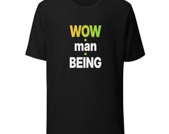 May include: A black short-sleeve t-shirt featuring the text WOW man BEING printed on the front. The word WOW is in a yellow to green gradient, while man and BEING are in white. The text is stacked vertically with small green dots.