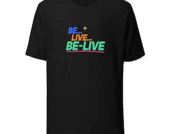 May include: A black short-sleeve t-shirt featuring the text BE... LIVE... BE-LIVE printed on the chest. The word BE is blue, LIVE is orange, and BE-LIVE is green, with a small yellow four-pointed star above and a pink line below.