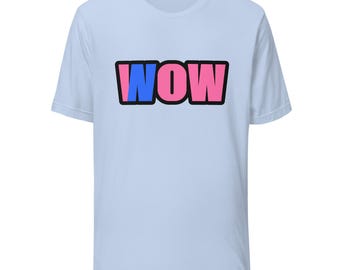 May include: A light blue short-sleeve t-shirt featuring the word WOW printed in the center. The letter W is blue, while the letters O and W are pink. Each letter is outlined in a thick black border, creating a bold graphic design on the chest.