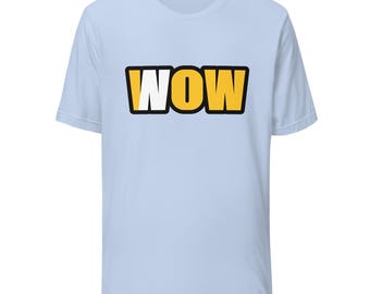 May include: A light blue short-sleeve t-shirt featuring the text WOW printed in a bold, yellow font with a thick black outline. The letter W on the left side is partially white, while the rest of the letters are solid yellow.