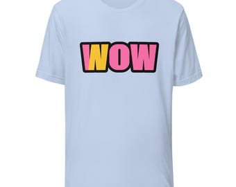 May include: A light blue short-sleeve t-shirt featuring the word WOW printed in the center. The letters are outlined in black, with the W in yellow and the O and W in pink. The shirt has a crew neckline and a standard fit, providing a simple design.