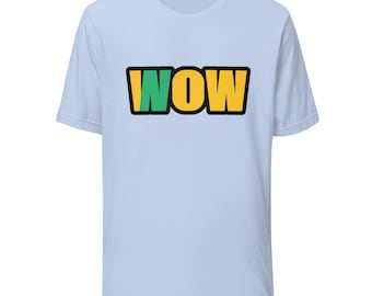 May include: A light blue short-sleeve t-shirt featuring the word WOW printed in the center. The letter W is green, while the letters O and W are yellow. Each letter is outlined in a thick black border, creating a bold graphic design.