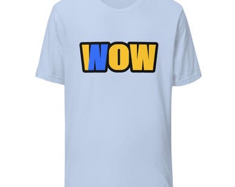 May include: A light blue short-sleeve t-shirt featuring the word WOW printed in the center. The letter W is colored blue, while the letters O and W are yellow. The entire text is outlined in a thick black border for high contrast.