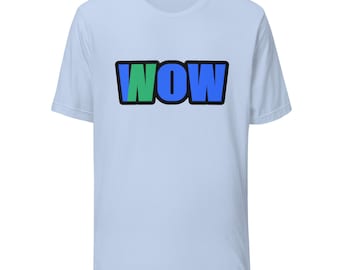May include: A light blue short-sleeve t-shirt featuring the word WOW printed in the center. The letters are outlined in black, with the W in green and the O and W in blue, creating a bold graphic design on the front of the garment.