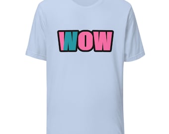 May include: A light blue short-sleeve t-shirt featuring the word WOW printed in a bold, block-letter style across the chest. The letter W is teal, while the letters O and W are pink, all outlined in a thick black border.