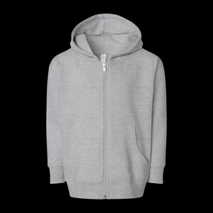 May include: A light heather gray zip-up hoodie featuring a full-length center zipper, a hood with a drawstring channel, and long sleeves. The garment is constructed from a soft, textured knit fabric with ribbed cuffs and a ribbed hemline.