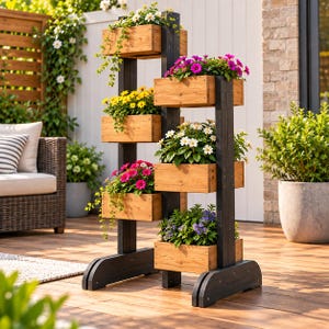 May include: A vertical tiered plant stand featuring a dark charcoal wooden frame with six rectangular natural wood planter boxes arranged in a staggered formation, each filled with various colourful blooming flowers and trailing green vines.