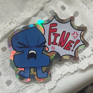 May include: A holographic sticker featuring a dark blue, anthropomorphic number two character with an angry expression, clenched fists, and a speech bubble containing the red text "FINE!" with small red angry symbols surrounding the word.