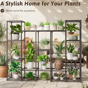 May include: A dark metal multi-tiered plant stand with a grid design, holding various potted plants of different sizes and foliage types. The text "A Stylish Home for Your Plants" and "Metal stand fits anywhere" is visible at the top.