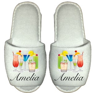 May include: White slippers with a colorful cocktail design and the name Amelia printed on the front.