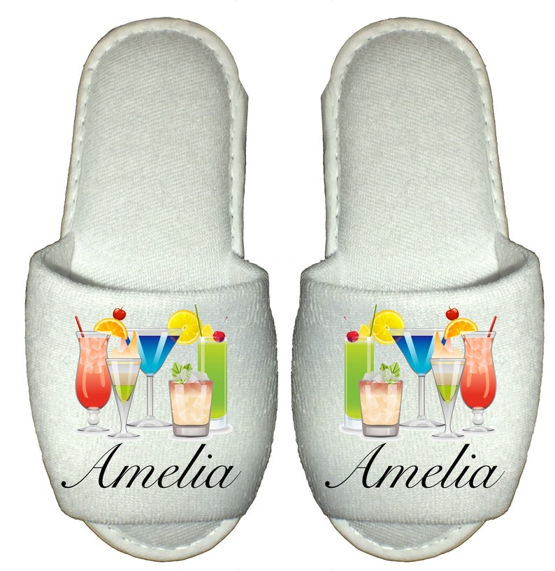 May include: White slippers with a colorful cocktail design and the name Amelia printed on the front.