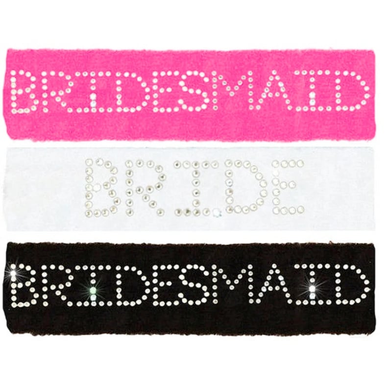 image of three personalised sweatbands for the head. one is pink, one is white and one is black. each is personalised with rhinestones to say a word such as bride or bridesmaid