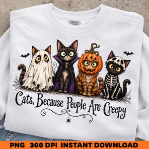 May include: A white sweatshirt featuring a graphic of four cats in Halloween costumes: one as a ghost, one as a vampire, one with a pumpkin head, and one as a skeleton. The text below reads, "Cats, Because People Are Creepy," with a small spider.