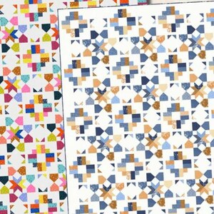 May include: A quilt pattern titled Road Map by Doug Leko Antler Quilt Design. The image displays two variations of a geometric star and block quilt design, one in vibrant multi-colors and one in shades of blue and tan, with sizes 43"x43", 60"x77", 77"x94".