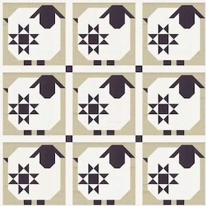 May include: A quilt featuring a repeating pattern of nine stylised sheep blocks. Each block displays a white sheep body with a dark charcoal head, legs, and a geometric star motif on the side, set against a light beige background with white borders.