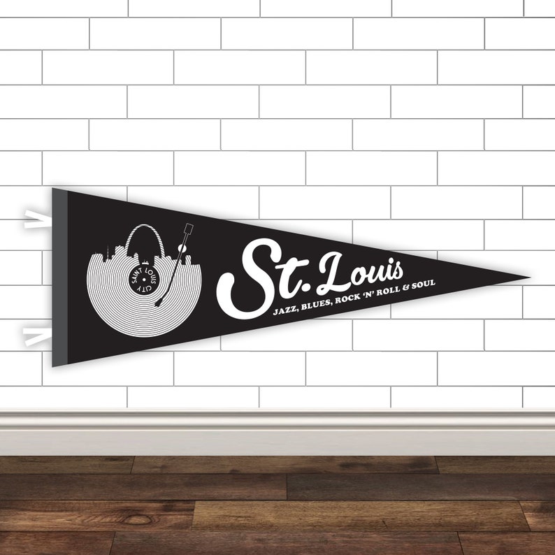 May include: Black and white pennant flag with a vinyl record design featuring the St. Louis skyline and the text "St. Louis Jazz, Blues, Rock 'n' Roll & Soul".