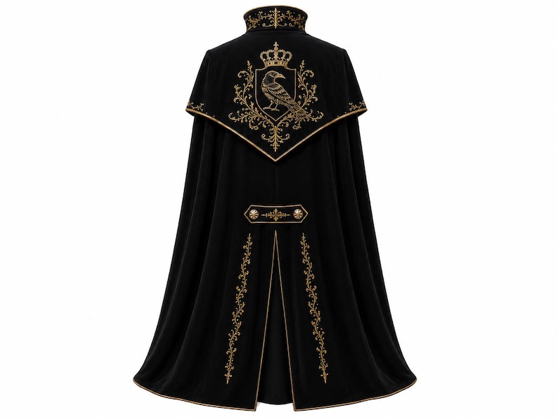 May include: A black cape featuring gold embroidery. The back displays a crest with a crown and a bird, flanked by ornate scrollwork. A horizontal tab with two gold buttons sits above a central vent, with vertical floral embroidery on the lower panels.