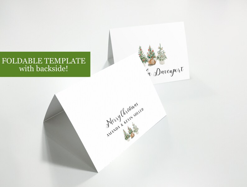 May include: A printable Christmas card template with a folded design. The front of the card features a watercolor illustration of three Christmas trees with ornaments and a burlap sack. The text "Merry Christmas Amanda & Kevin Miller" is printed on the front of the card. The back of the card features the text "The Davenport" and a watercolor illustration of three Christmas trees with ornaments and a burlap sack.
