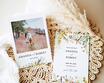 May include: Save the date card with a watercolor floral design. The card says "Save Our Date" with the names Amanda and Robert and the date April 14th, 2025. The card also includes the location Philadelphia, PA.
